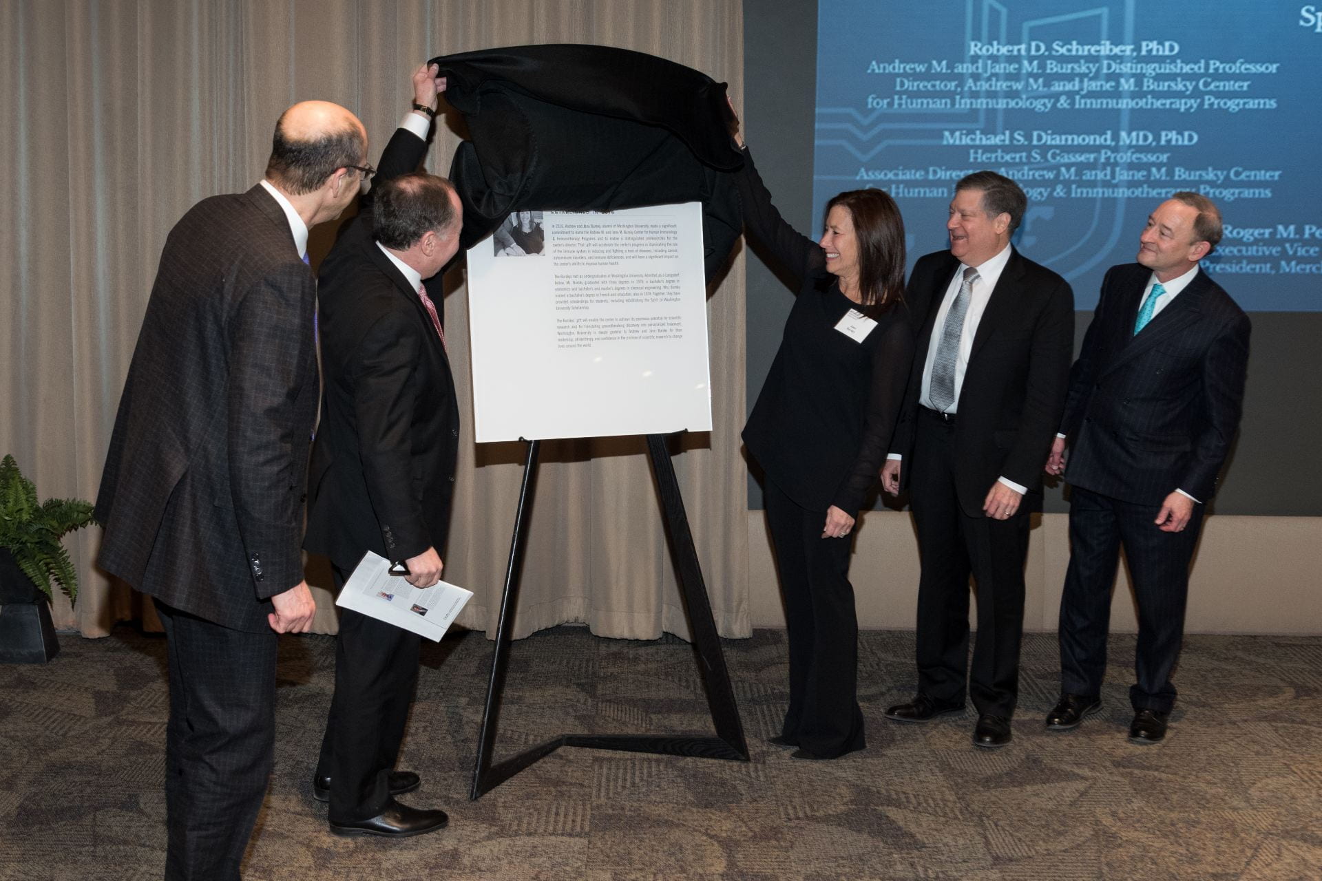 Unveiling of the plaque honoring the creation of the Bursky Center. Dean Perlmutter, Andy Bursky, Jane Bursky, Bob Schreiber and Chancellor Wrighton (left to right).