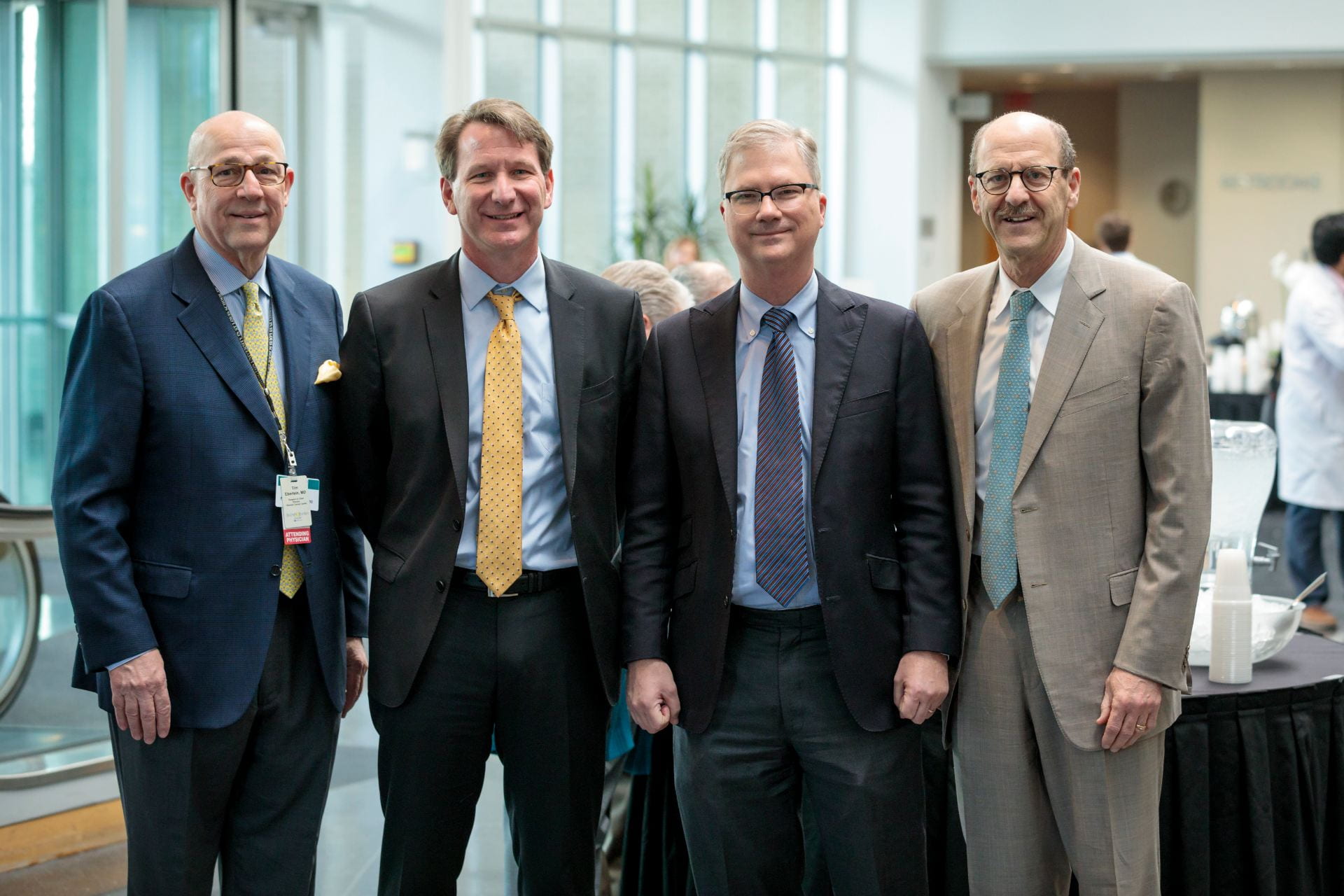 Timothy Eberlein, MD, Director of Siteman Cancer Center, left, NCI Director Norman E. "Ned" Sharpless, MD, Provost Holden Thorp, and Dean David Perlmutter