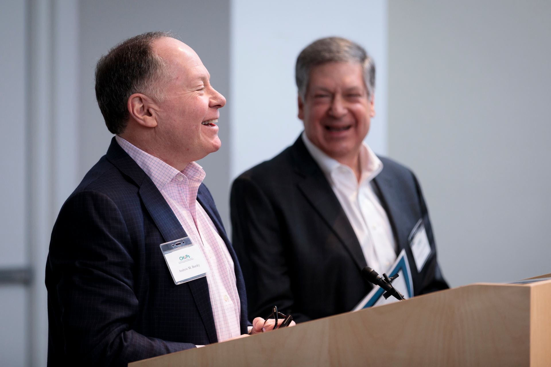 Andrew Bursky, left, and Robert Schreiber, PhD, enjoy a moment during the welcome to The Burksy Center at Washington University 2nd Annual Symposium