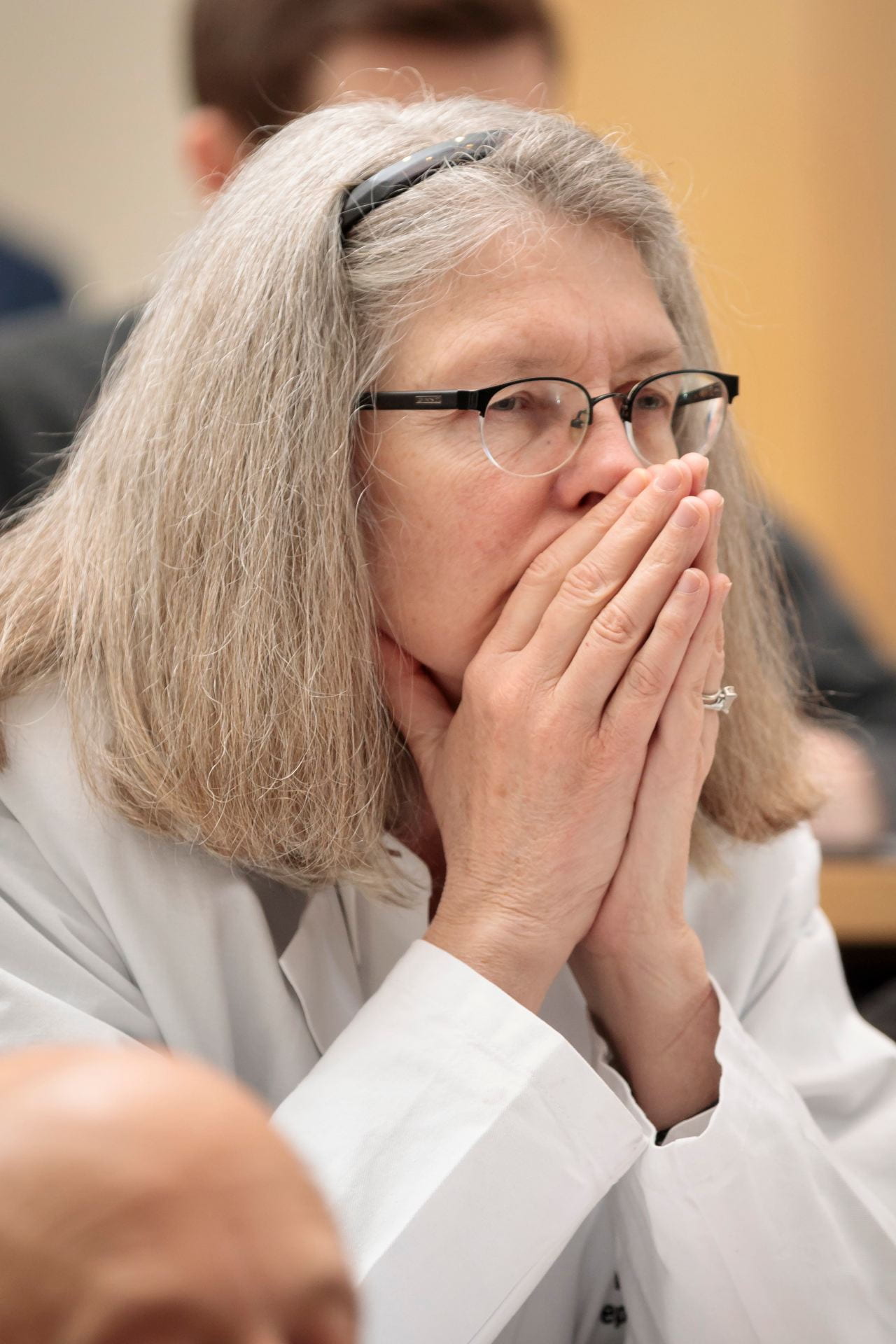 Vicky Fraser, MD, head of the Department of Medicine, listens to the lectures