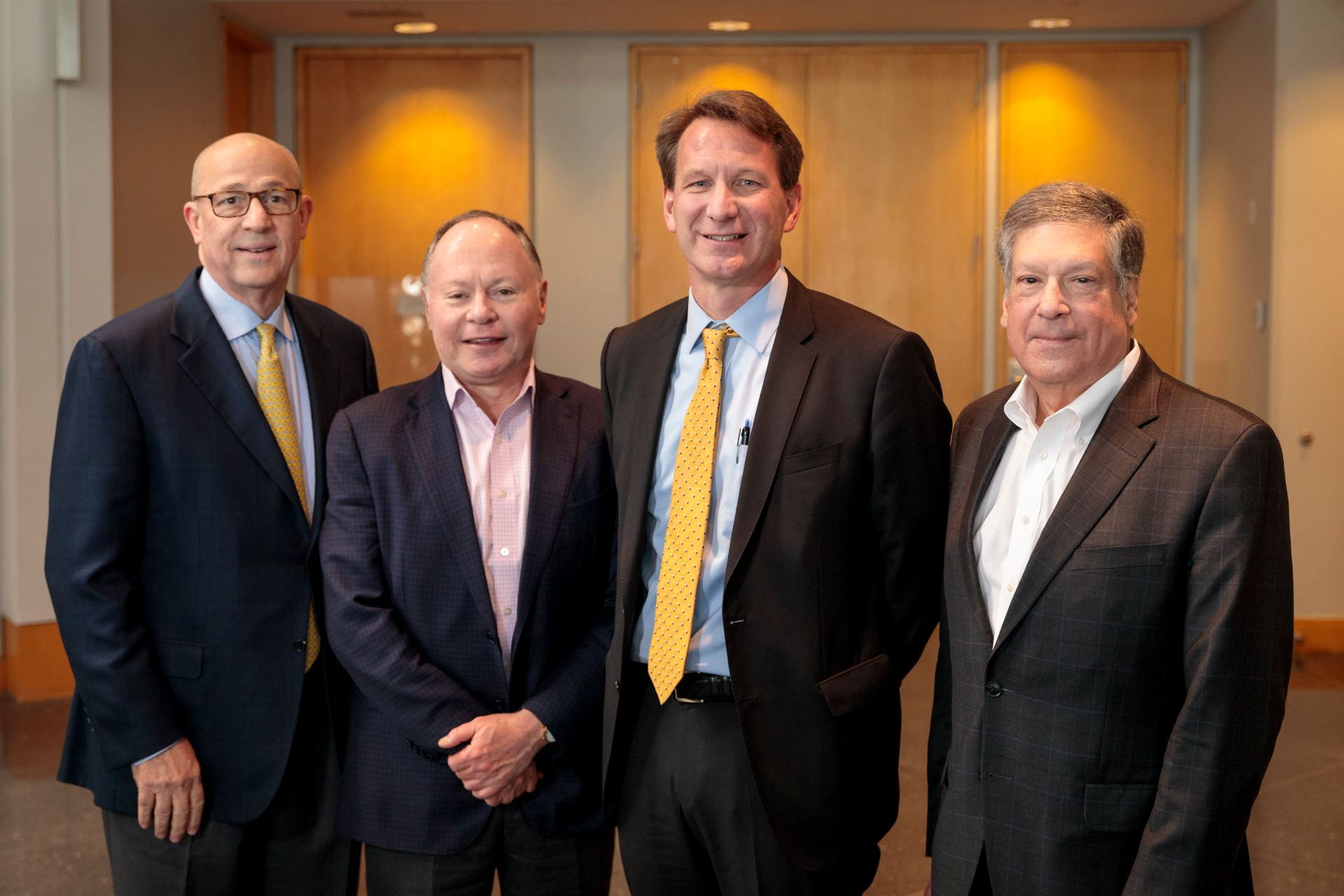 Siteman Cancer Center Director Timothy Eberlein, left, Andrew Bursky, NCI Director Norman E. "Ned" Sharpless, MD, and Robert Schreiber, PhD