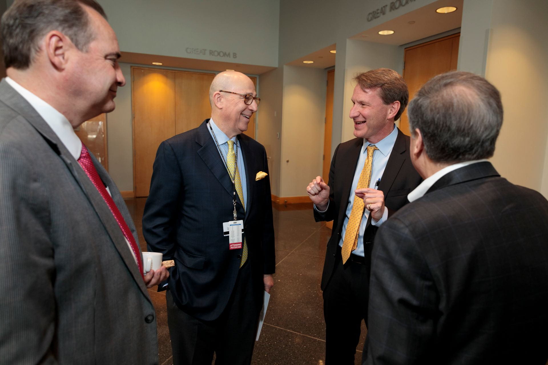 Dennis Hallahan, MD, Chairman of the Department of Radiation Oncology, left, Timothy Eberlein, MD, Director of Siteman Cancer Center, NCI Director Norman E. "Ned" Sharpless, MD, and Robert Schreiber, PhD, talk during a break.