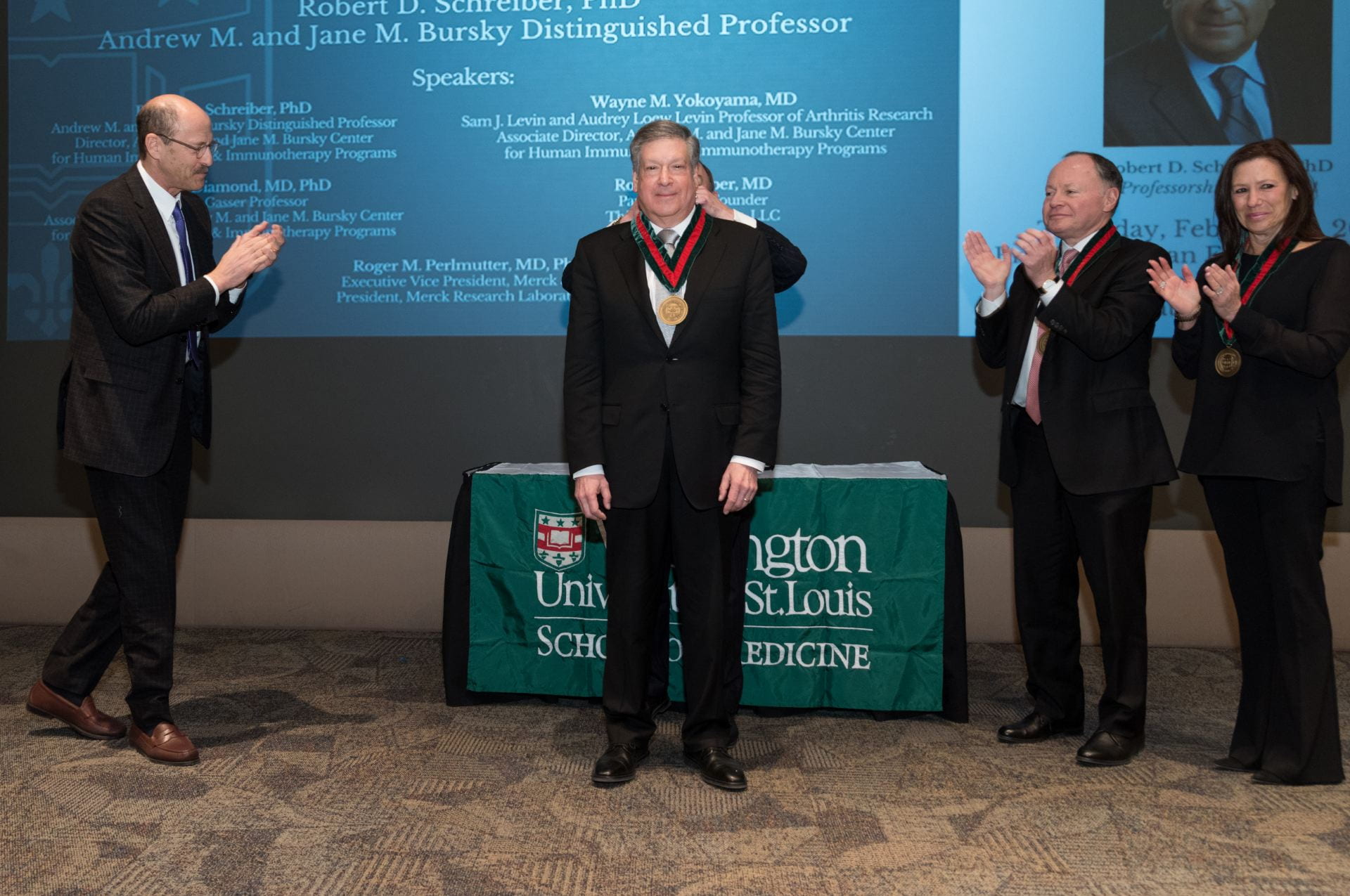 Chancellor Wrighton bestows upon Dr. Robert D. Schreiber the Andrew M. and Jane M. Bursky Distinguished Professor medallion.