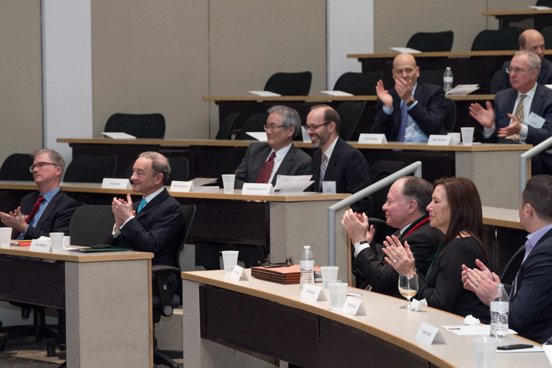 Distinguished guests applaud Dr. Schreiber's presentation on novel advances in cancer immunotherapy.
