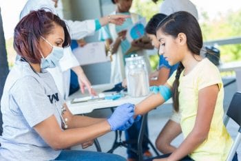 Nurse administers flue vaccine
